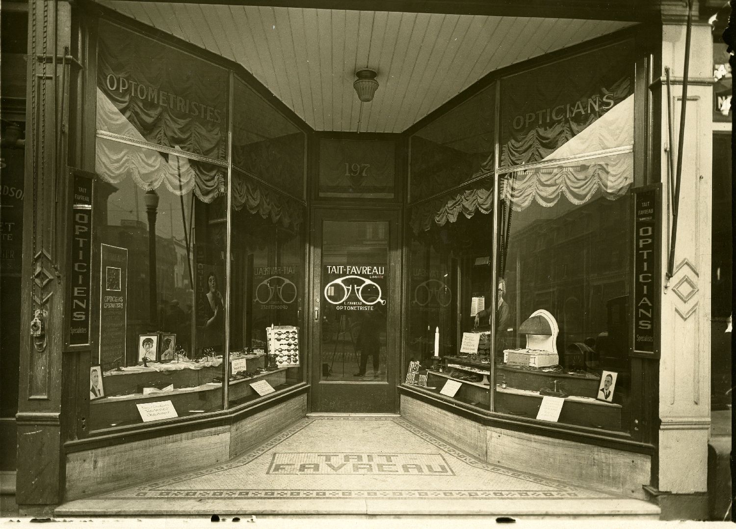Archive photograph of the Tait-Favreau optometrist storefront on Sainte-Catherine Street in Montreal.